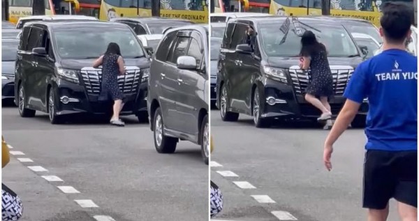 在馬來西亞警方通緝的移民檢查站阻止移動汽車的婦女