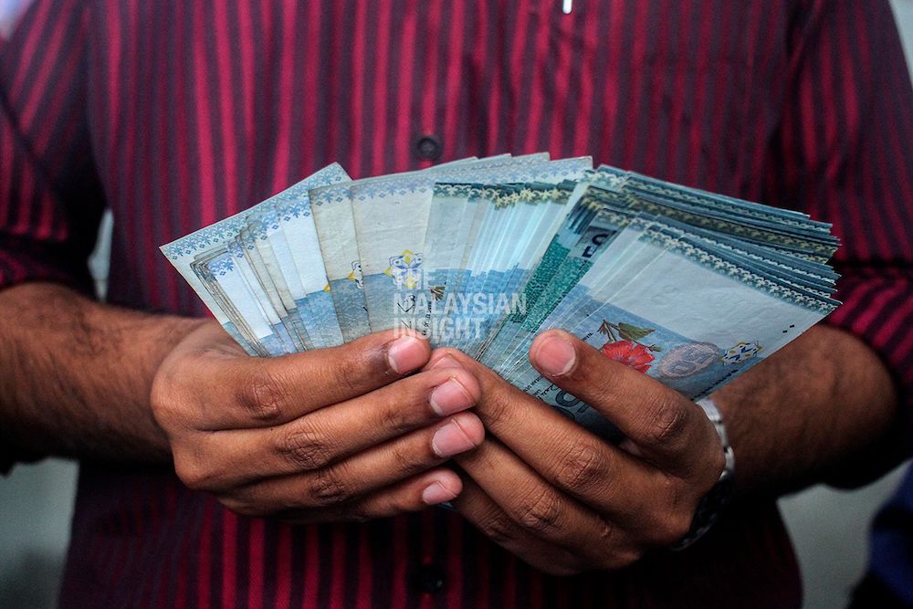 ringgit-closes-lower-against-dollar
