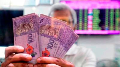 ringgit-ends-on-weaker-note-against-us-dollar-ahead-of-state-elections