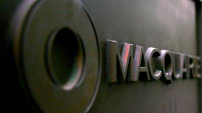 australia’s-macquarie-to-buy-back-shares,-half-year-profit-slips