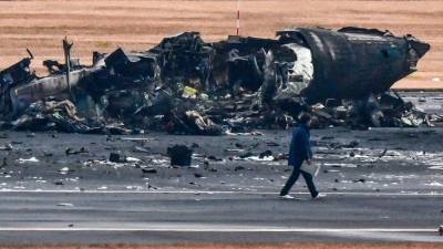 japan-probes-plane-inferno-after-‘miracle’-escape