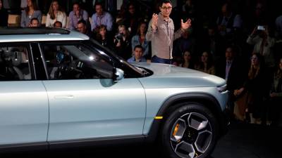 rivian-shows-off-smaller,-less-expensive-evs,-hastens-delivery-plans