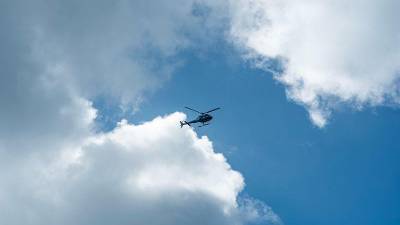 helicopter-crashes-in-bali-after-entanglement-with-kite-strings,-all-five-onboard-survive