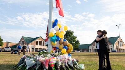 father-charged-along-with-son,-14,-in-us-school-shooting